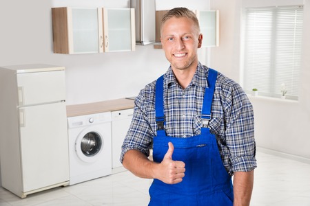 fridge repairman showing thumbs up sign