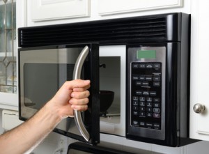 Over the range microwave oven service technician