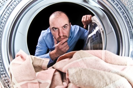 man checking dryer