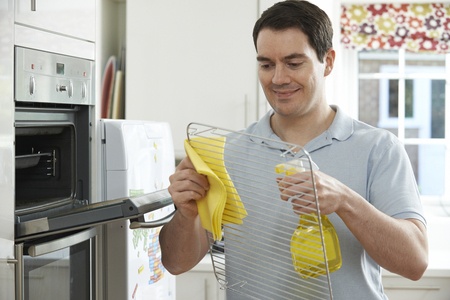 cleaning oven in kitchen